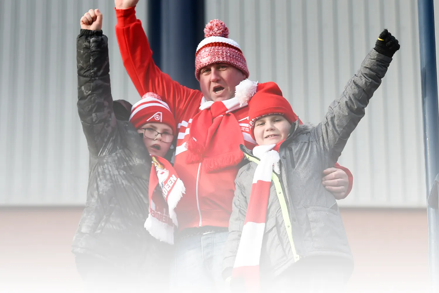 Excited supporters prepare to go into Pittodrie on match day