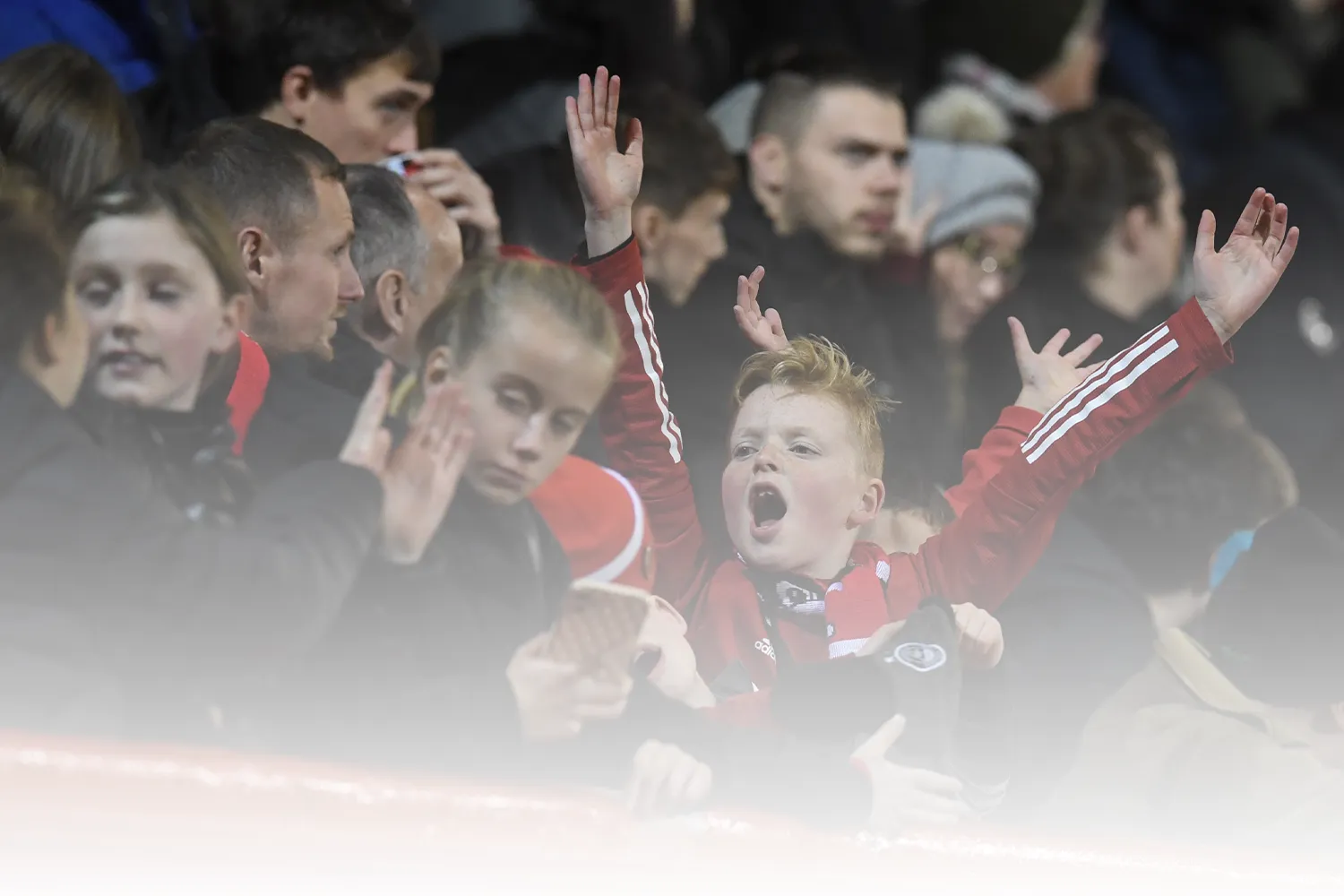 Young fans enjoying an Aberdeen match