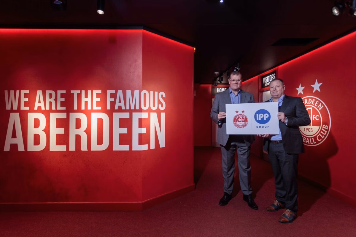 Rob Wicks, Commercial Director of Aberdeen FC with Group CEO of IPP Group, Jared Ayres inside Pittrodrie Stadium at the launch of the partnership announcement Rob Wicks, Commercial Director of Aberdeen FC with Group CEO of IPP Group, Jared Ayres inside Pittrodrie Stadium at the launch of the partnership announcement
